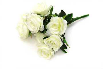 Bouquet of artificial white roses on white background