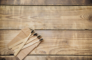 Eco-friendly bamboo toothbrushes in a craft bag. The concept of zero waste without plastic.