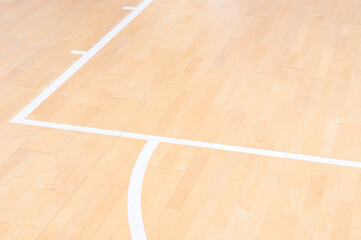 Wooden floor  basketball, badminton, futsal, handball, volleyball, football, soccer court. Wooden floor of sports hall with marking white lines on wooden floor indoor, gym court