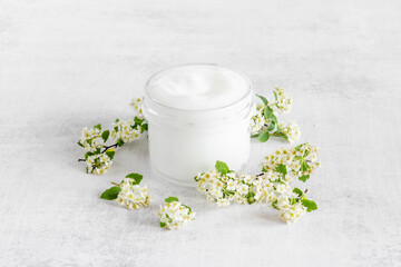 White spa medical herbal cosmetic with blossoms flowers