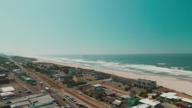 4k Aerial coastal town with beach and ocean in background