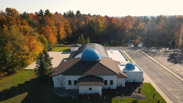 Fall conditions with rising drone over cool building.