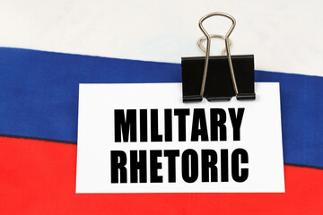 On the flag of Russia there is a business card with the inscription - Military rhetoric