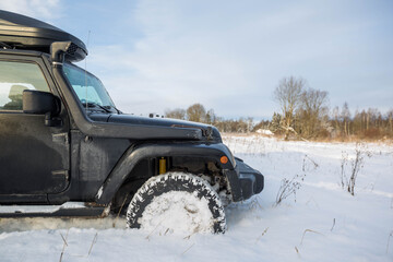 Black SUV in deep snow