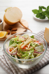 Delicious turnip salad served on white wooden table