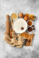 Fototapeta na wymiar Ingredients for gingerbread cookies on a light gray culinary background. Assortment of food for Christmas or New Year's holiday baking top view 