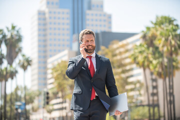 voice contact. telephone connection. happy ceo talk on cellphone. phone call. mobile technology.