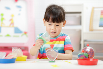 young girl making sand  crafts for homeschooling