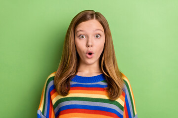 Fototapeta premium Portrait of attractive sweet funny girly girl sudden news reaction pout lips isolated over bright green color background