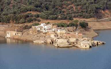 The flooded village of Sfendili on the shores of the Aposelemi Dam reservoir, Lasithi (Lassithi) Plateau, Eastern Crete, Greece.