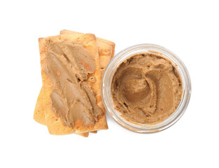 Crispy crackers and delicious meat pate on white background, top view