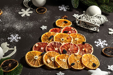 Festive fir tree from dried fruits. Christmas or New Year festive flat lay, food creative
