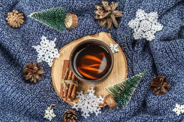Black tea in ceramic cup with traditional New Year decoration