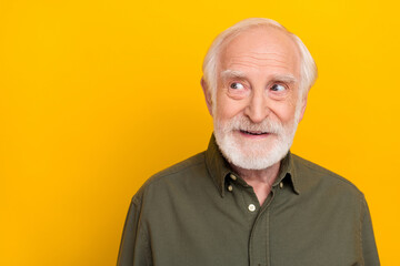 Photo of cute aged beard man look promo wear khaki shirt isolated on yellow color background