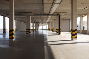 Empty open car parking garage on sunny day