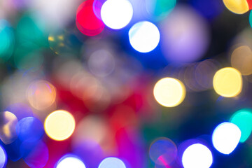 Christmas background. Photo of blurred Christmas lights at night. Defocused