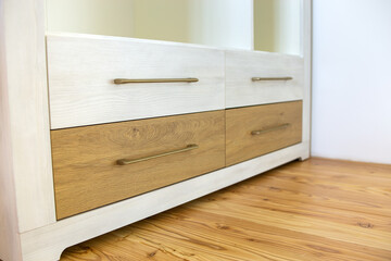 Close up of wooden drawer in contemporary cupboard cabinet.