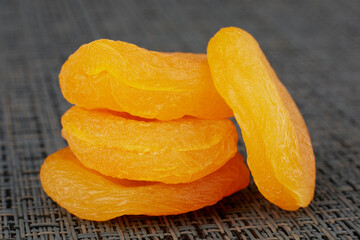 Close-up photo of dried apricots, stacked on top of each other