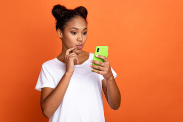 Profile side photo of young lovely african woman shoot picture smartphone isolated over orange color background