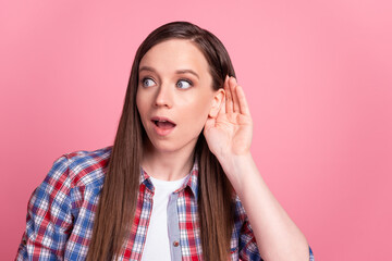 Photo of young lovely girl arm near ears listen gossip conversation look empty space isolated over...