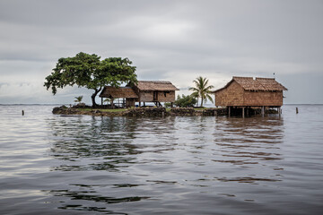 Traditional houses on a small artificial island in Lau Lagoon, Malatia Provence, Solomon Islands.