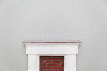fireplace on the background of an empty gray wall with stars in a room close up