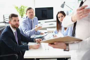 Smart man making presentation for colleagues, manager showing finance statistics to team