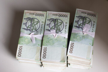 Stack of Korean currency 10000 won banknote isolated.