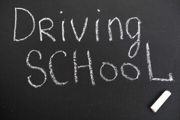 Driving school chalkboard, Educational and Creative composition with the Driving school caption. toy car model.