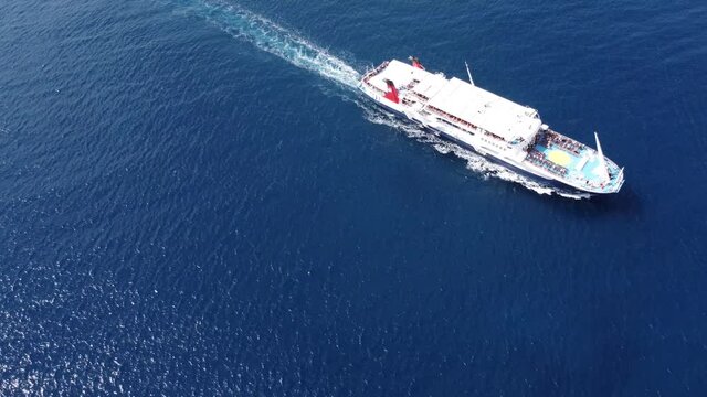 Passenger ship departing from port with destination Greek Islands.