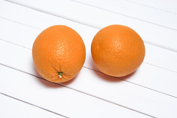 Oranges on a white wooden table
