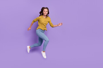 Full length profile portrait of excited active person running toothy smile isolated on violet color background