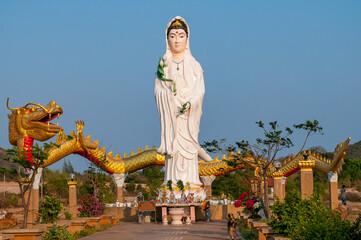 Statue of a lady Buddha, bodhisattva Guanyin, south of Hua Hin on the road between Pranburi and Sam Roi Yot in Prachuap Khiri Khan Province of Thailand.