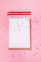 Blank Notepad and Red Pencils on Pink Background Vertical Copy Space Business Concept