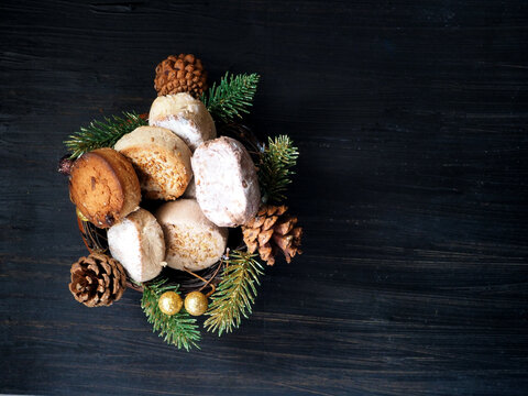 Spanish Christmas sweets Estepa, Polvoron, Mantecado, Nevaditos, fir branches and cones