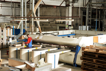A modern factory with equipment for the production of furniture. Modern technologies in the industrial production of furniture.