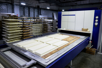 A modern factory with equipment for the production of furniture. Modern technologies in the industrial production of furniture.