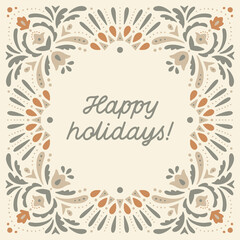 Holiday card with ornate decorative frame and "Happy holidays!" lettering.