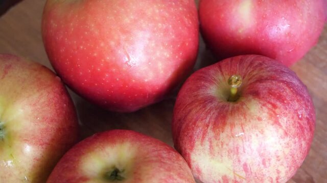 Ligol and gala apples, fruits close-up. Video with rotating red apples.
