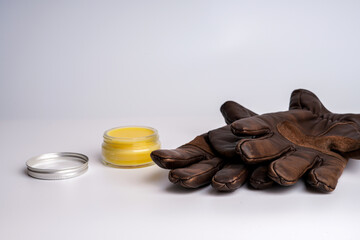 Winter flat lay with cream and gloves 