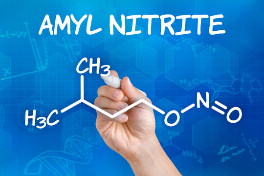 Hand With Pen Drawing The Chemical Formula Of Amyl Nitrite