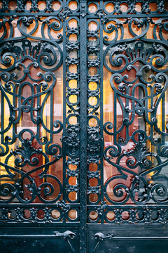 Beautiful wrought iron gates with monograms and floral designs
