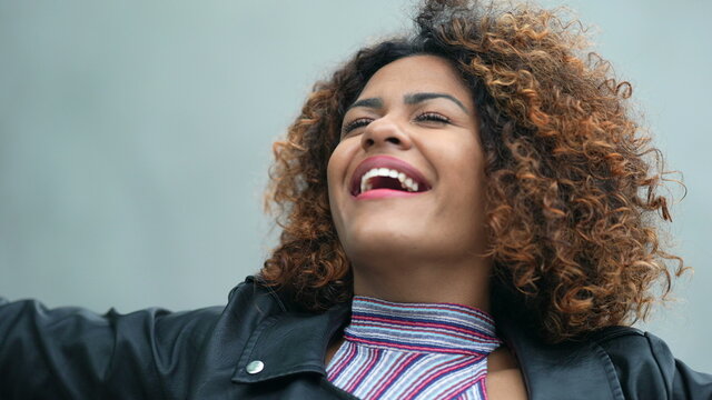 Carefree black woman portrait smiling feeling free