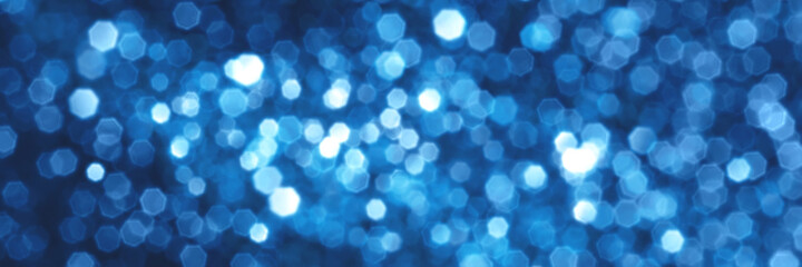 Blue sparkling glitter bokeh background, christmas texture. Holiday lights. Abstract defocused header. Wide screen wallpaper. Panoramic web banner with copy space for design