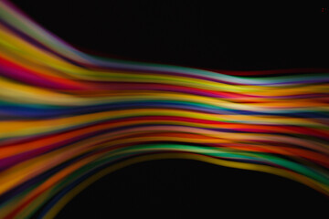 Colored lines of light on a black background.