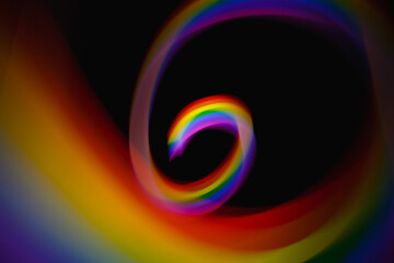 Blurred light rainbow lines. Colored streaks of light.