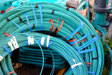 Rolls of light blue underground fibre optic cable.