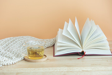 pages spread of open book isolated on wood background.