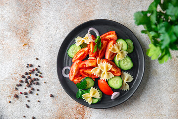 pasta salad vegetables and farfalle healthy meal food snack on the table copy space food background rustic top view