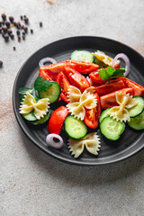 pasta salad vegetables and farfalle healthy meal food snack on the table copy space food background rustic top view